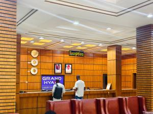 a group of people standing in a lobby at Jun Yue 9 Hotel Kano in Kano