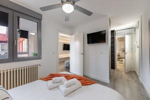 En eller flere senge i et værelse på Waou Living Albacete