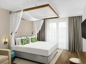 Postel nebo postele na pokoji v ubytování Mövenpick Balaland Resort Lake Balaton