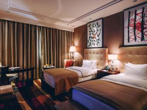 Postel nebo postele na pokoji v ubytování Rixos Borovoe