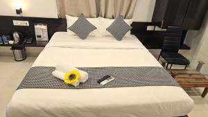 Ένα ή περισσότερα κρεβάτια σε δωμάτιο στο Basil Inn