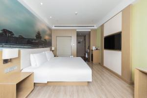 Μια τηλεόραση ή/και κέντρο ψυχαγωγίας στο Orange Hotel Beijing Yizhuang Bridge Subway Station +22 φωτογραφίες