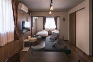 TV a/nebo společenská místnost v ubytování Lumen豊田 中長期滞在向コンドミニアム トヨタ自動車本社徒歩5分