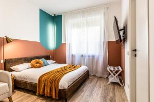 Postel nebo postele na pokoji v ubytování MARS SUITE Style & Relax Centro Livorno