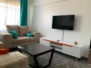 TV a/nebo společenská místnost v ubytování Inka Residency Kisumu
