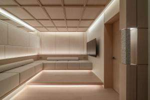 a room with white furniture and a ceiling with lights at 에스티르 신사 호텔 Estir sinsa hotel in Seoul