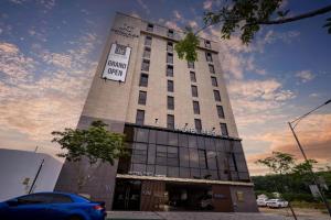 a building with a sign on the front of it at Hotel PIED Suseong in Uksu