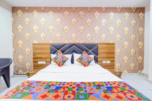 Postel nebo postele na pokoji v ubytování FabHotel Lake View I