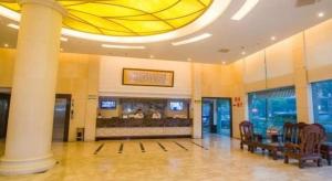 a large lobby with a large ceiling with a glass at GreenTree Alliance Zhejiang Zhoushan Putuoshan Zhujiajian Scenic Spot Hotel in Zhoushan