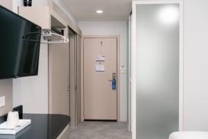 Μια τηλεόραση ή/και κέντρο ψυχαγωγίας στο One Budget Hotel Chiangrai Maesai Payang +10 φωτογραφίες