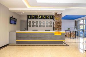 a restaurant with a counter in a room at 7 Days Inn Yining Xintiandi in Yining