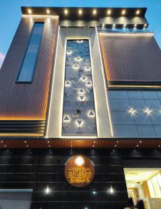 a building with a sign on the side of it at Hotel Holiday Dreamz in Amritsar