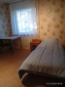 Ένα ή περισσότερα κρεβάτια σε δωμάτιο στο Cozy place