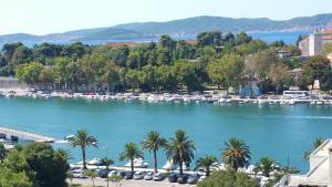 a view of a river with boats in a harbor at Panorama Apartment in Zadar