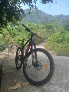 a bike parked on the side of a road at Homestay Rammang Rammang in Baloci