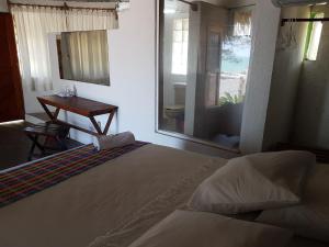 Postel nebo postele na pokoji v ubytování Hotel El Doral + 18 fotografií