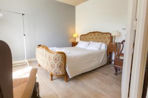 Postel nebo postele na pokoji v ubytování La Petite Maison de Barousse