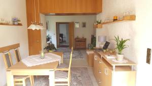 a kitchen with a table and chairs and a dining room at Fewo Blütenreich in Traben-Trarbach