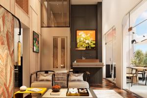 a living room with a couch and a table at HAITA Suites in Ho Chi Minh City