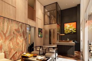 a living room with a table and chairs at HAITA Suites in Ho Chi Minh City