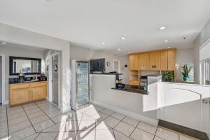a kitchen with a counter and a refrigerator at Rodeway Inn Stockton Highway 99 in Stockton
