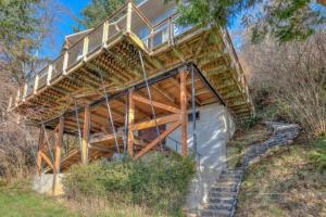 a house with stairs leading up to it at Stunning Beachfront Cabin with Barbecue and Hot-tub in Otis, Oregon in Three Rocks