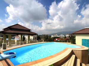 a swimming pool on the roof of a building at The Xym Hotel in Chiang Mai