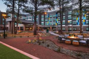 a hotel with a fire pit in a courtyard at Tru By Hilton Flagstaff in Flagstaff