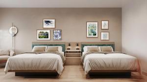 a bedroom with two beds and a couch at Cambria Hotel Euless - DFW Airport South in Euless