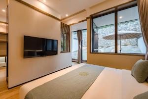 Μια τηλεόραση ή/και κέντρο ψυχαγωγίας στο Huazhu Luxury Tai'an Lile and Xiyuan