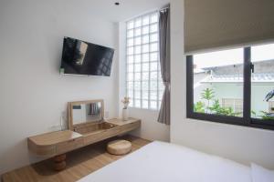 Μια τηλεόραση ή/και κέντρο ψυχαγωγίας στο Adory Homestay Huế