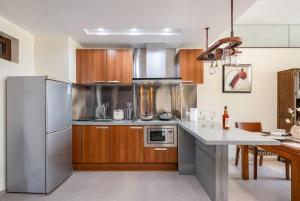 Kuchyň nebo kuchyňský kout v ubytování 来咖海景民宿酒店陵水清水湾阿罗哈店 + 2 fotografie