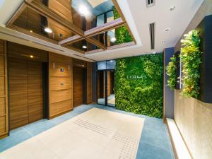 Postel nebo postele na pokoji v ubytování Super Hotel Premier Osaka Honmachi Ekimae Natural Hot Springs