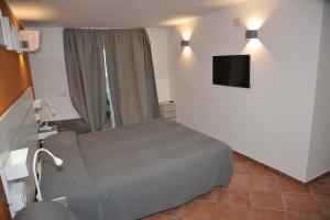 TV a/nebo společenská místnost v ubytování Alla Quercia