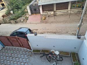an aerial view of a car and a motorcycle at C-57, Nitin khandelwal in Jaipur +4 photos
