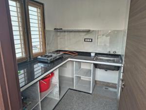 a kitchen with a sink and a counter top at C-57, Nitin khandelwal in Jaipur