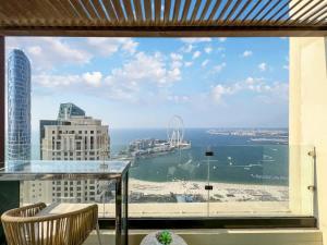 a view of the ocean from a hotel window at FAM Living- Luxe Penthouse in JBR Marina - Panaromic Sea View in Dubai