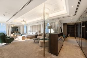a large living room with a bed and a couch at FAM Living- Luxe Penthouse in JBR Marina - Panaromic Sea View in Dubai