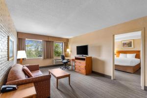 a hotel room with a bed and a television at Travelodge by Wyndham Winchester in Winchester