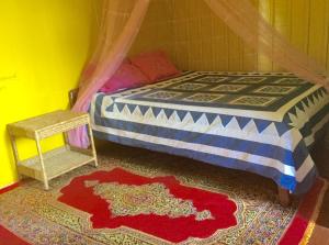 A bed or beds in a room at Bunyong Homestay