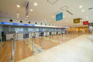 an airport with a row of machines in a terminal at Hilton Tokyo Bay in Urayasu +139 photos