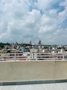 a view of a city from the roof of a building at Hotel Chandram - 450mtr I 10min walking from ShreeNath Ji temple Nathdwara 966o9o1oo6 in Nāthdwāra +9 photos