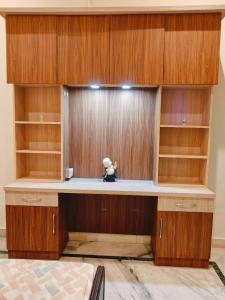 a desk with a teddy bear sitting on top of it at Urban Retreat in Agra
