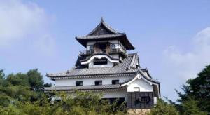 a large white building with a clock tower at Inuyamakan in Inuyama +46 photos