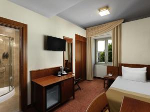 Ένα ή περισσότερα κρεβάτια σε δωμάτιο στο Mercure Szekesfehervar Magyar Kiraly +152 φωτογραφίες