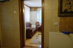 a view of a living room with a couch at Vila Simon in Câmpulung Moldovenesc