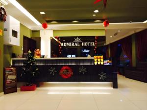 an animal hotel with a christmas tree in a room at Admiral Hotel in Kampong Lumut Kiri