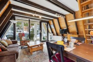 a living room with a couch and a table at Ferienhaus Seyer in Lichtenberg