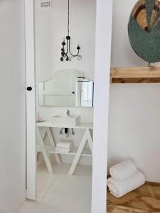 a bathroom with a sink and a mirror at Stay at Richmond in Richmond