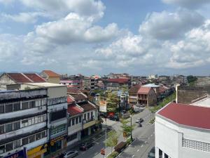 a view of a city with buildings and a street at Kimal Hotel Taiping in Taiping